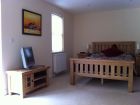 Oak Room Double bed and TV